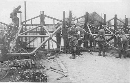 German soldiers break through antitank barrier
